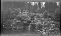 Mertie West strolls through the Cascade of Time Garden, Banff, 1947