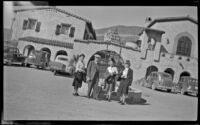 Zetta Witherby, Wes Witherby, Mertie West and Dode Witherby pose in front of Scotty's Castle, Death Valley National Park, 1947