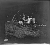 Elizabeth, Frances and Mary West and Kate, Chester and Irene Schmitz posing around their camp dining table, Warner Springs vicinity, about 1915