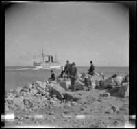 Spectators watch as the Catalina ferry sails from San Pedro harbor and into the distance, Los Angeles, about 1910