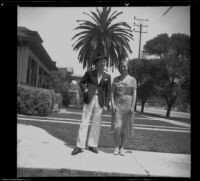 H. H. West Jr. and Josephine Covert stand in front of the West's house, Los Angeles, 1938