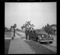 Mertie, Nella, Wilson, Richard, and Eleanor West stand on the sidewalk by Wilson's Studebaker, Los Angeles, 1937