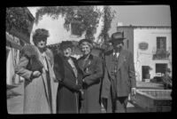 Dode Witherby, Zetta Witherby, Mertie West and H. H. West pose in the courtyard at El Paseo, Santa Barbara, 1945