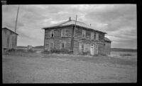 Warehouse and former hotel stands along the road, Circle, 1946