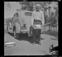 Forrest Whitaker poses with his catch of trout, Big Bear Lake, 1944