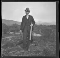 H. H. West poses with a lone rabbit and his gun, Duarte, about 1897