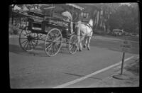 Horse-drawn wagon travels along a Boston street, Boston, 1947