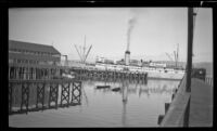 Distant view of the Aleutian docked at Orca, Cordova vicnity, 1946