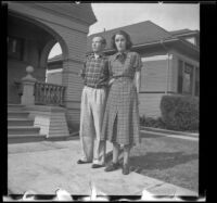 H. H. West Jr. and Jane Deming stand in front of the West's house, Los Angeles, 1937