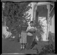 Dorothea and Richard Siemsen stand in the front yard of their house, Glendale, about 1938