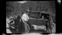 Forrest Whitaker, H. H. West, Jr. and Mertie West pose by H. H. West's Chandler car, Redlands vicinity, about 1927