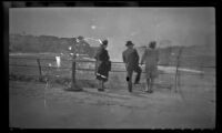 Mertie West and 2 other visitors stand at a guardrail overlooking the American Falls, Niagara Falls, 1947