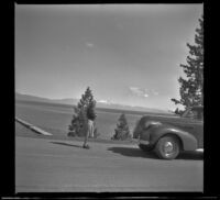 Mertie West stands in the road above Lake Tahoe, Lake Tahoe, 1942