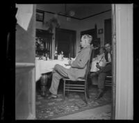 Wilhelmina West, Guy West, and H. H. Cooper sit around a table, Los Angeles, 1897