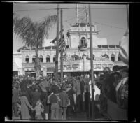 Spectators line East Colorado Avenue by Bard's Colorado Theater to watch the Rose Parade, Pasadena, 1941