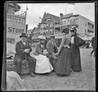 George M. West, Daisy Conner, Harry Hershey Cooper sit while Nella West and Wilhelmina West stand next to them, Santa Catalina Island, about 1901