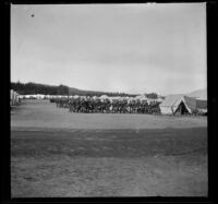 Artillery troops march through their camp at the Presidio, San Francisco, 1898
