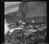 Nella Brydolf and three of her fellow teachers in a classroom, Burlington, 1900