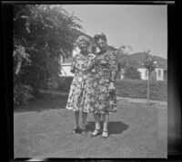 Mertie West and Frances Wells pose on the front lawn of the Siemsen's residence, Glendale, 1944