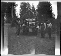 Harry Schmitz, John Bidwell and Wilfrid Cline, Jr. posing by the car, Shasta County, 1917