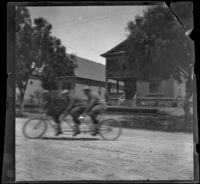 Men ride on a three-seat tandem bicycle, Los Angeles, 1897