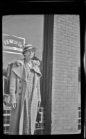 Helen Goforth stands in front of H. H. West's office on Towne Avenue, Los Angeles, 1939