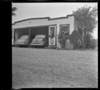 Mertie West stands outside the West's motel room, San Jose, 1942