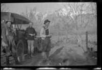 Al Schmitz, Charlie Stavnow and Elmer Cole stand in their camp near Taboose Creek, Big Pine vicinity, about 1920