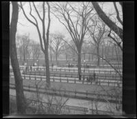 Park with benches, trees, and pedestrians, Boston, 1914