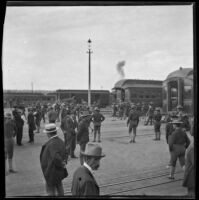 Soldiers and others at a railroad station, Denver, 1900