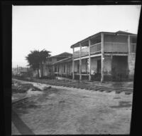 Old Customhouse with railroad tracks in front, Monterey, about 1898