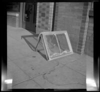Aluminum window propped up on a sidewalk, Los Angeles, 1948 — Calisphere