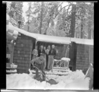 Neil Wells, Mertie West, Agnes Whitaker, Frances Wells, H. H. West, Jr. and Forrest Whitaker standing on the front porch of the Neil Wells cabin, Big Bear, 1932