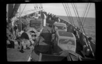 Steerage passengers stand on the bow of the ship, Seattle vicinity, 1946