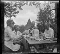 Agnes Whitaker, Mertie West, Forrest Whitaker, and William Shaw eating breakfast, Inyo County vicinity, about 1930