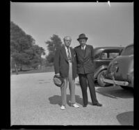Dr. Bim Smith and H. H. West pose in a parking lot at Norwalk State Hospital, Norwalk, 1943