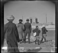 Mrs. George M. West, Bessie Velzy, Glen Velzy, Frances West and Elizabeth West stand and watch the Catalina Island ferry as it leaves San Pedro, Los Angeles, about 1910