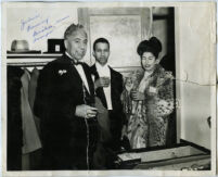 Julian Rainey with a couple at a party, Los Angeles, early 1950s