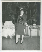 Unidentified African American woman at an art show with ceramic work by Wilmer James, Los Angeles, 1940s