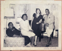 Billy Rowe, of the Pittsburgh Courier, and three unidentified women, Los Angeles, late 1940s or early 1950s