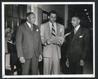 Walter L. Gordon, Jr. with two clients after a trial, Los Angeles, 1940s