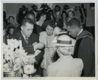 Rev. Hamilton (Ham) Boswell performing a baptism, Los Angeles, 1940s