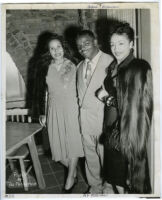 Abie Robinson, Los Angeles Sentinel reporter and editor, with two unidentified women, Los Angeles, 1940s