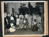 Esther Beck and her mother, Jennie S. Bruington posing with a group in a yard, Los Angeles, 1930s?