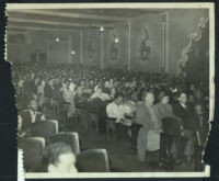 Large, racially-mixed audience in an auditorium, Los Angeles, 1950s