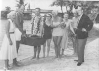 Edwin Pauley, Ed Carter, Harriet & Charles Luckman, and Troy Post at beach party