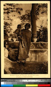 Woman holding her son, Vishakhapatnam, India, ca.1920-1940