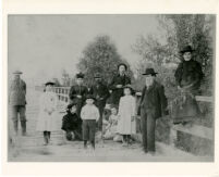 Group of people posing on a bridge