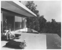 Rice House, Richard J. Neutra & woman on terrace