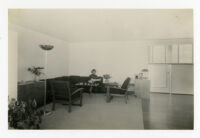 Strathmore Apartments, corner seating area with woman reading, Los Angeles, California, 1937